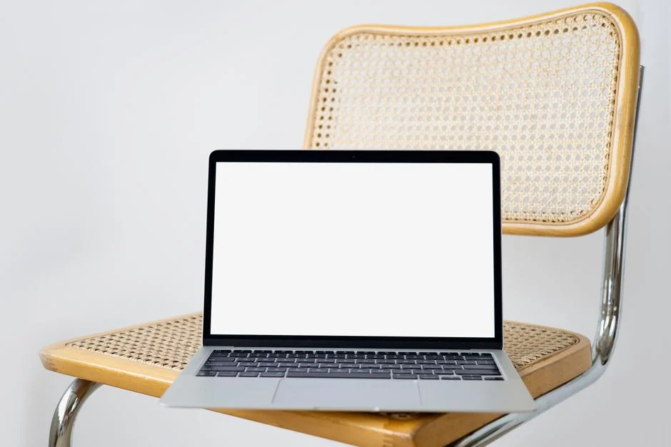 A modern computer screen displaying web design work, showcasing creative visuals in a workspace.